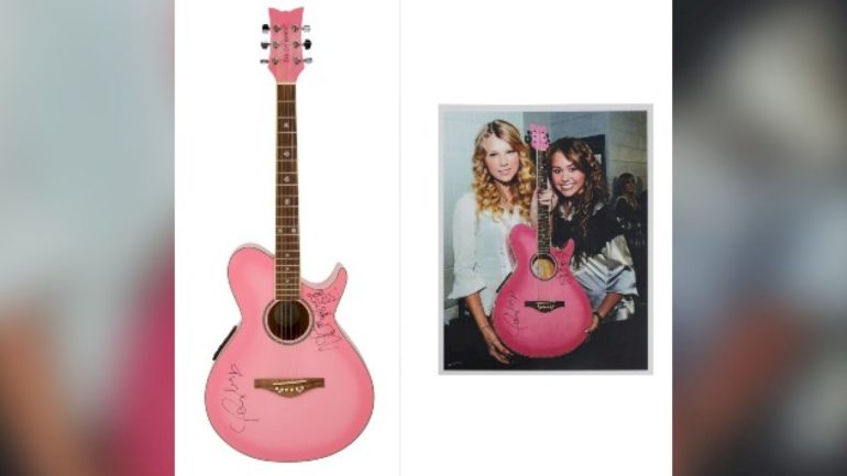guitar-signed-by-taylor-swift-and-miley-cyrus-sells-for-$104k-at-auction