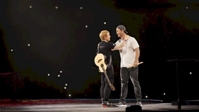 ed-sheeran-challenges-chris-hemsworth-to-play-the-drums-in-‘limitless:-live-better-now’