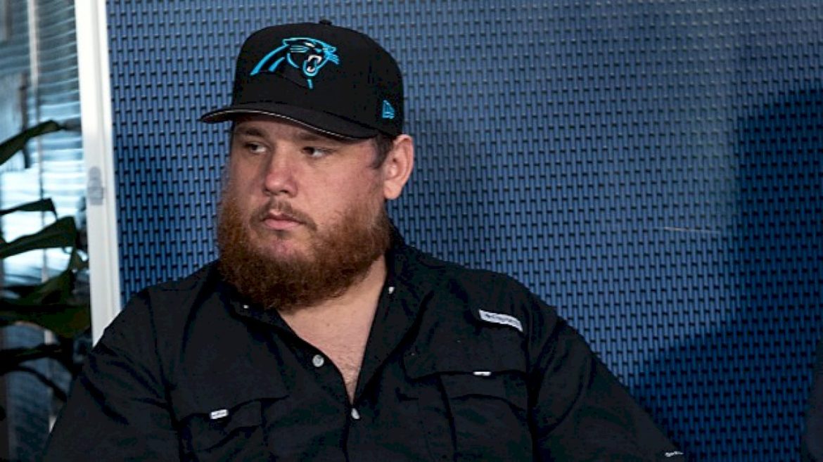 luke-combs-keeps-pounding,-teams-with-carolina-panthers-for-new-merch-line
