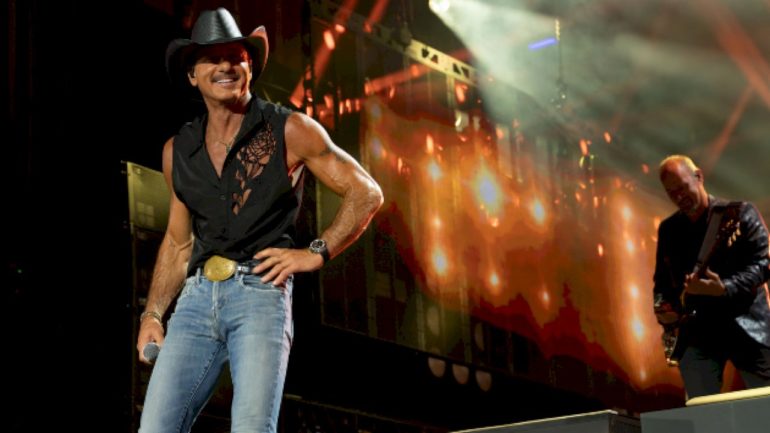 the-symbolic-gift-tim-mcgraw’s-giving-at-every-pawn-shop-guitar-stop